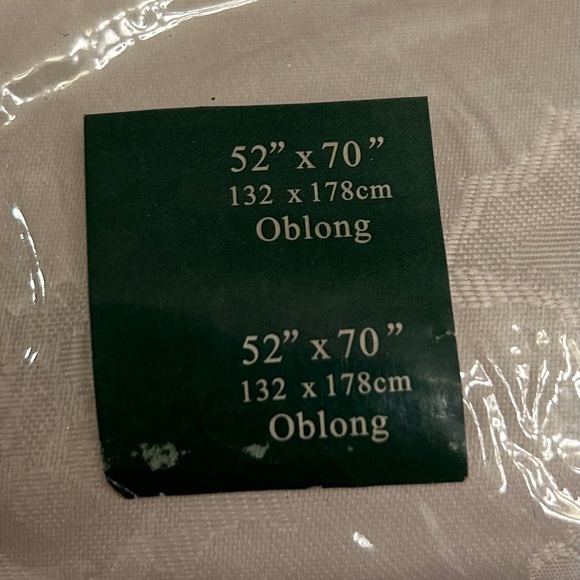 New in package. Ivory/cream 52”x70” oblong tablecloth. - Picture 4 of 5